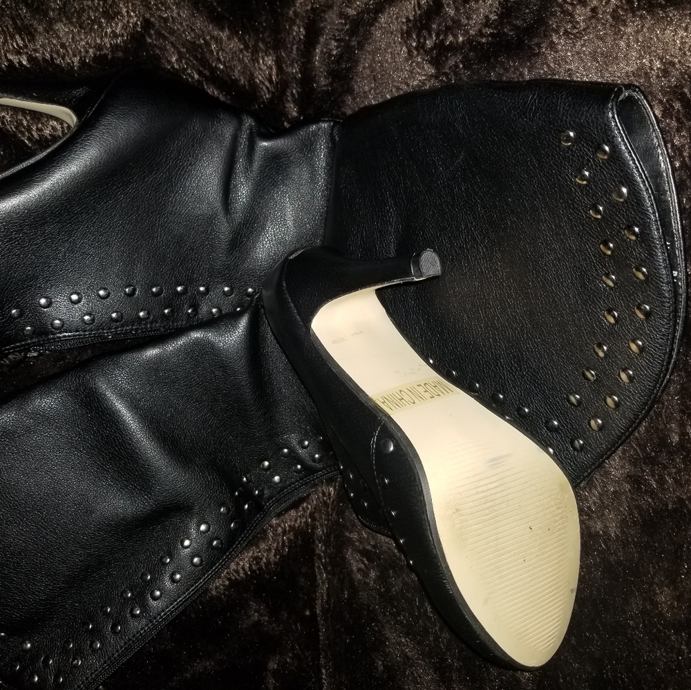 Knew high studded boots